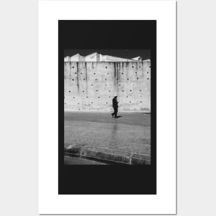 Man Walking Past Ancient City Wall Posters and Art